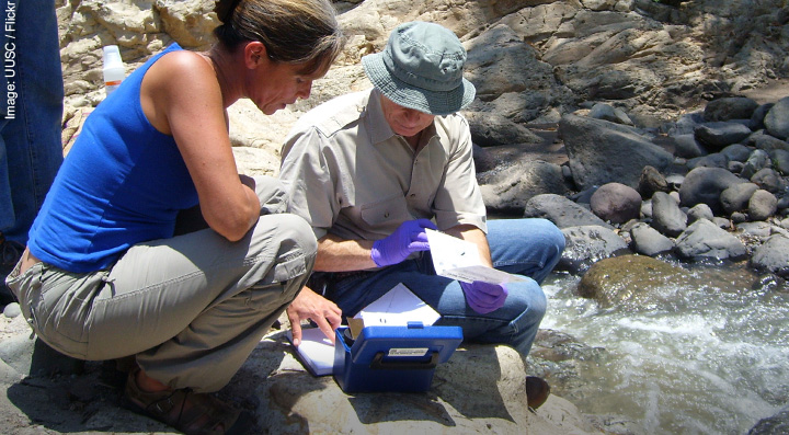 Environmental Geologists monitoring stream pollution